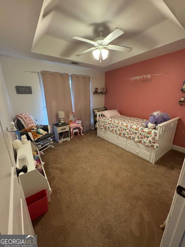 bedroom with visible vents, a ceiling fan, and carpet floors