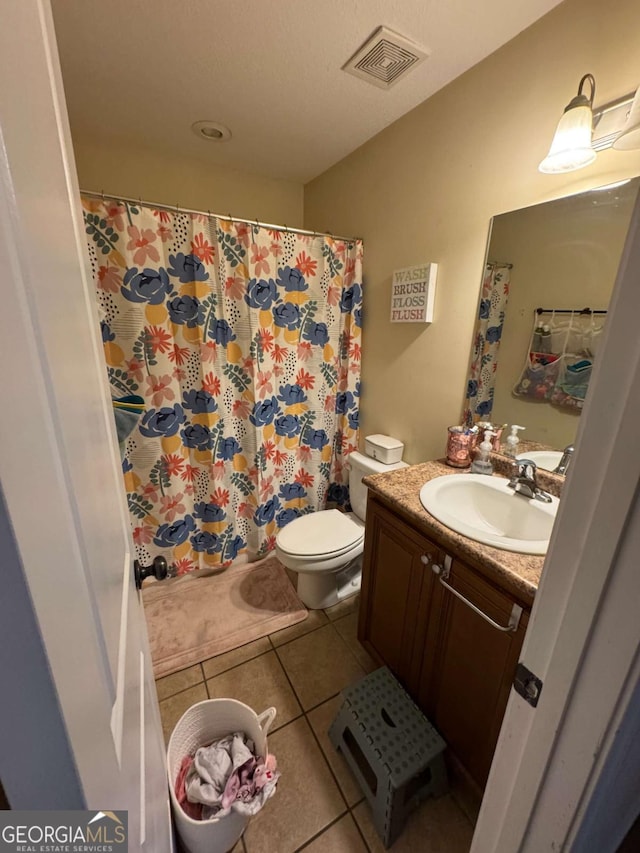 full bath featuring tile patterned floors, visible vents, toilet, and vanity