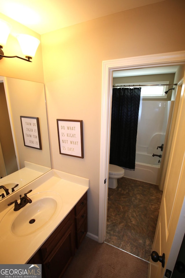 full bath featuring vanity, shower / tub combo, and toilet