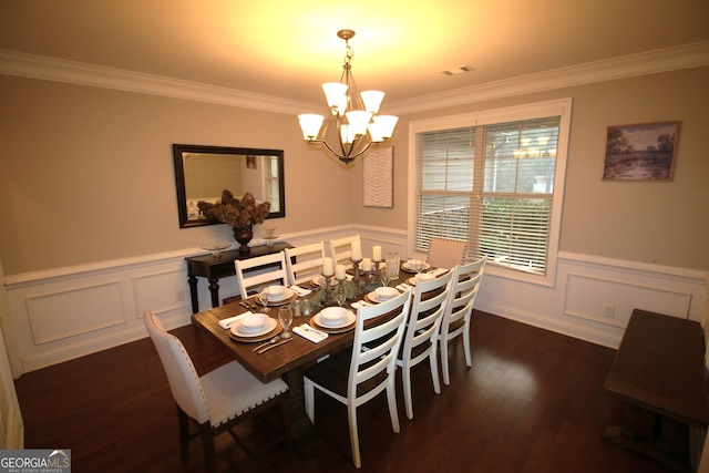 dining space with dark wood-style floors, visible vents, crown molding, and a chandelier