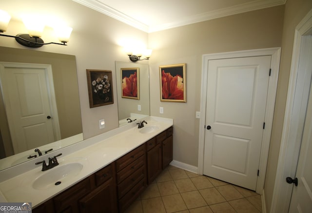 bathroom featuring tile patterned floors, ornamental molding, double vanity, and a sink