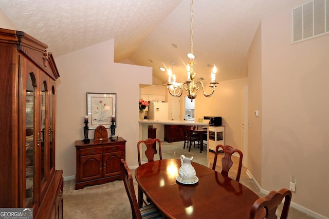 dining room with visible vents, an inviting chandelier, lofted ceiling, a textured ceiling, and light carpet