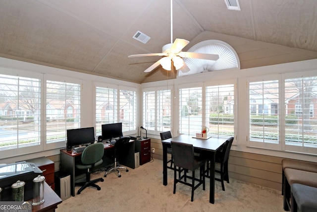 office with light carpet, visible vents, ceiling fan, and lofted ceiling