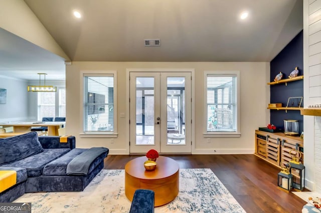 interior space with visible vents, dark wood finished floors, lofted ceiling, recessed lighting, and french doors