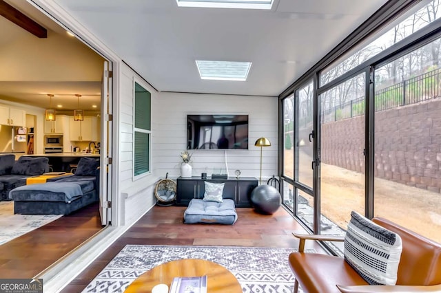 sunroom / solarium featuring a skylight