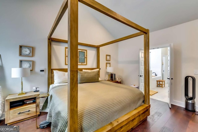 bedroom featuring hardwood / wood-style floors and vaulted ceiling