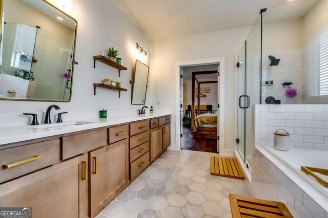 bathroom with double vanity, a stall shower, ensuite bathroom, a bath, and a sink