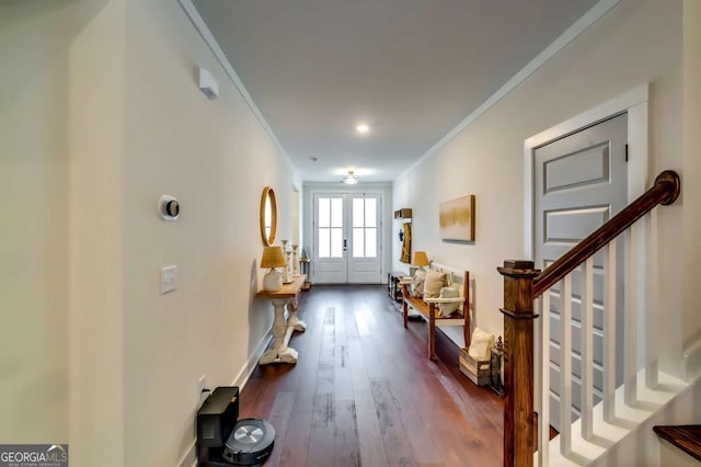 entryway with stairs, crown molding, french doors, and dark wood finished floors