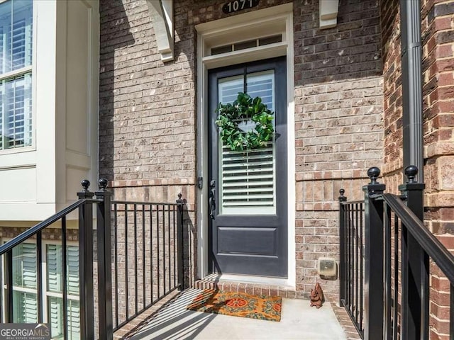 entrance to property with brick siding