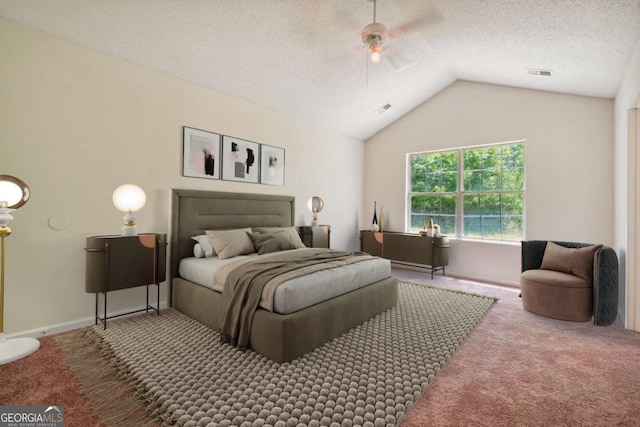 bedroom featuring carpet flooring, visible vents, a textured ceiling, and lofted ceiling