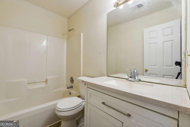 bathroom featuring visible vents, toilet, vanity, and  shower combination