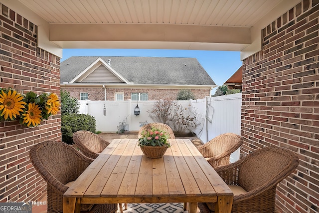 view of patio / terrace featuring outdoor dining space and fence private yard