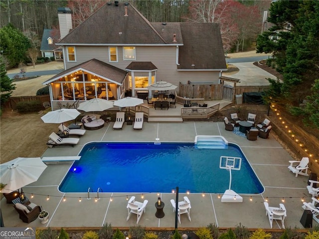 back of property featuring a fenced backyard, an outdoor hangout area, outdoor dining area, and a deck