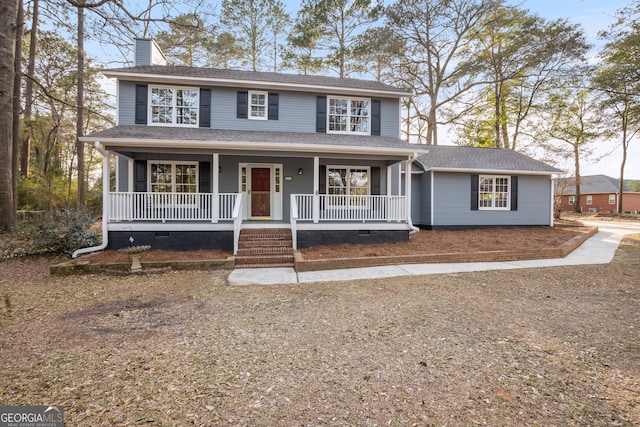 view of front of home with crawl space, a porch, a chimney, and roof with shingles