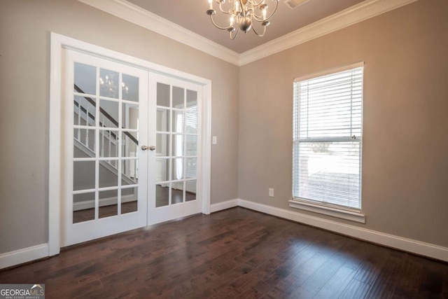 spare room with french doors, baseboards, dark wood-type flooring, and crown molding