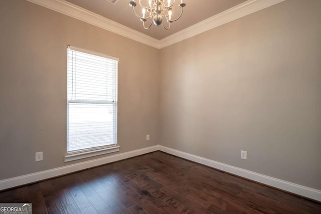 unfurnished room with dark wood finished floors, baseboards, a chandelier, and ornamental molding