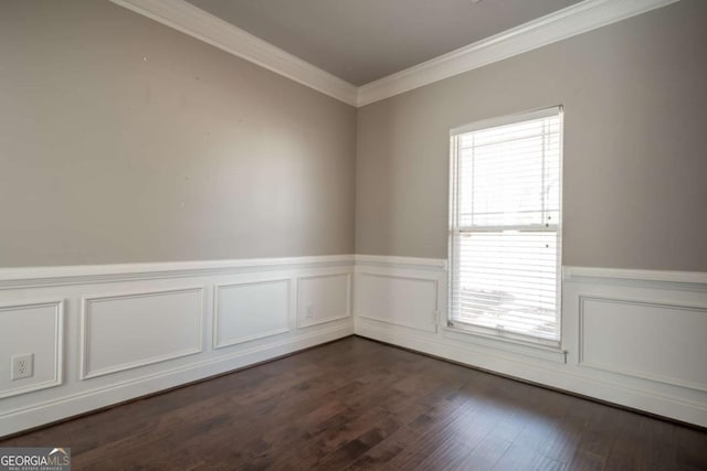 spare room featuring a wainscoted wall, crown molding, and dark wood-style flooring