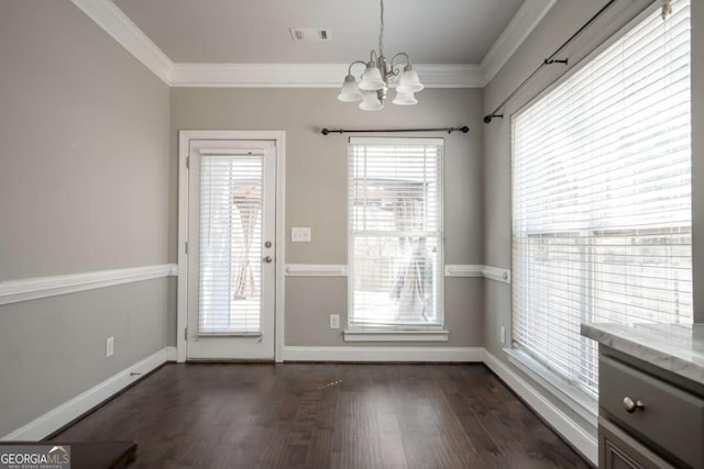 doorway to outside with a notable chandelier, visible vents, dark wood finished floors, and ornamental molding