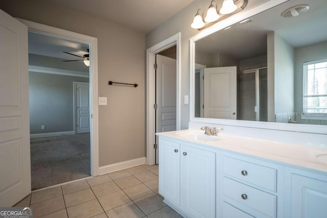 full bathroom featuring vanity, visible vents, ceiling fan, a shower stall, and tile patterned floors