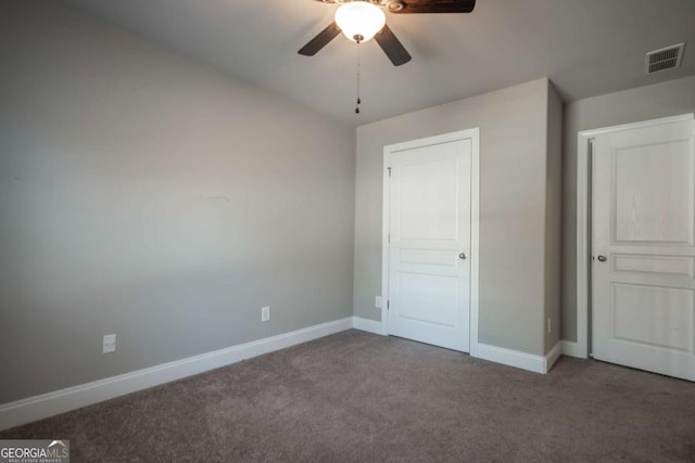 unfurnished bedroom with visible vents, baseboards, ceiling fan, and carpet flooring