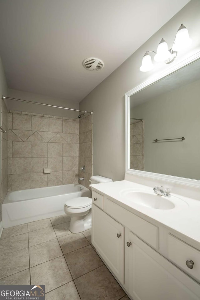 bathroom featuring vanity, visible vents, tile patterned flooring, bathtub / shower combination, and toilet