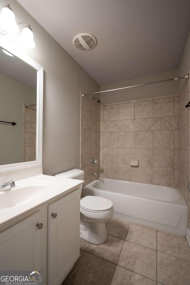 bathroom with visible vents, toilet, shower / tub combination, tile patterned flooring, and vanity