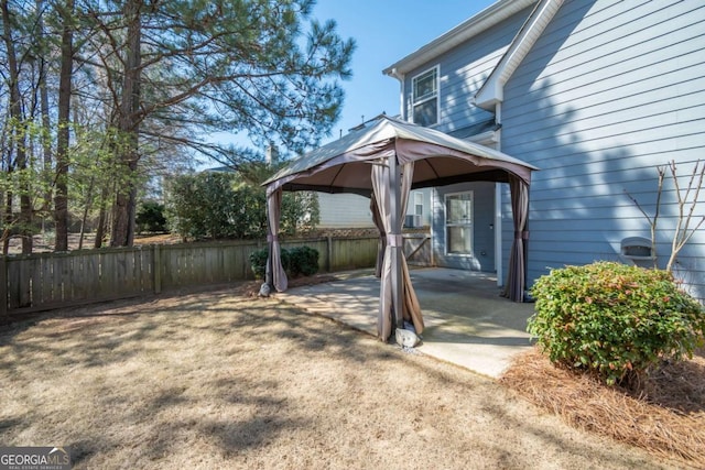 view of yard featuring a gazebo, a patio area, and fence