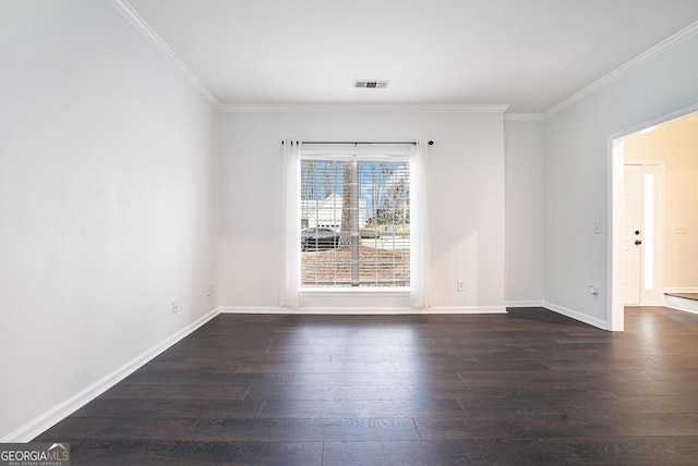 spare room with visible vents, crown molding, dark wood-type flooring, and baseboards