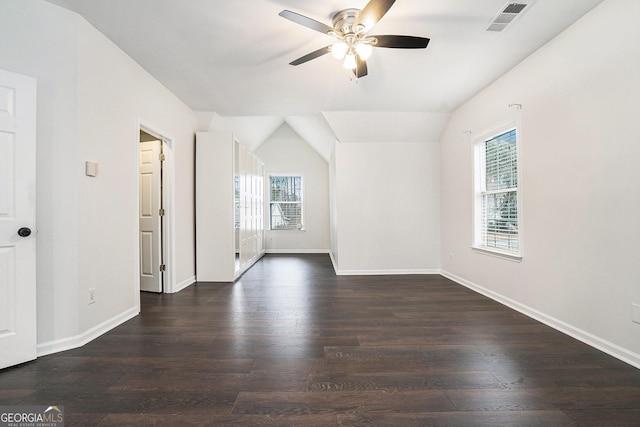 unfurnished room featuring ceiling fan, visible vents, baseboards, and wood finished floors