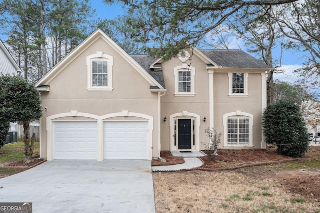 view of front facade featuring a garage, stucco siding, driveway, and roof with shingles