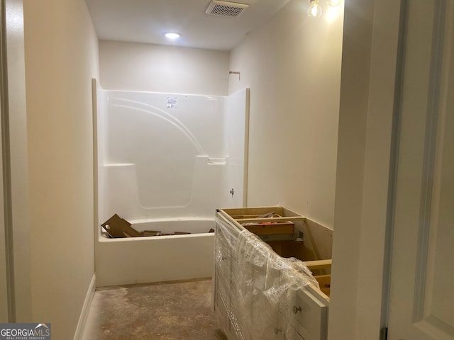 full bath with visible vents, tub / shower combination, and concrete flooring