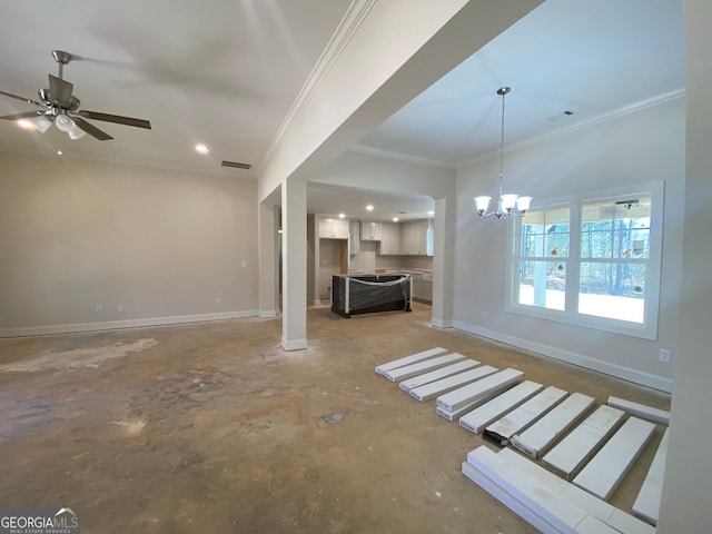 unfurnished living room featuring visible vents, ceiling fan with notable chandelier, baseboards, and ornamental molding