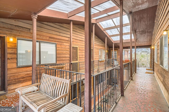 exterior space with lofted ceiling with skylight