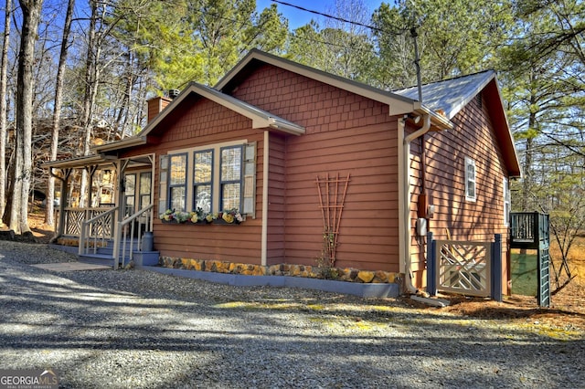 chalet / cabin featuring a chimney