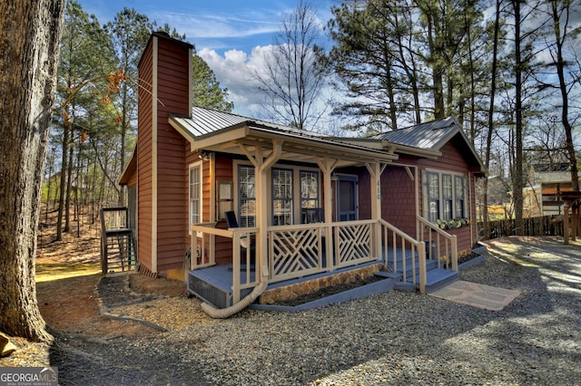 view of outbuilding with covered porch