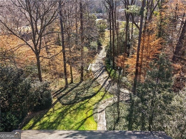 drone / aerial view with a view of trees