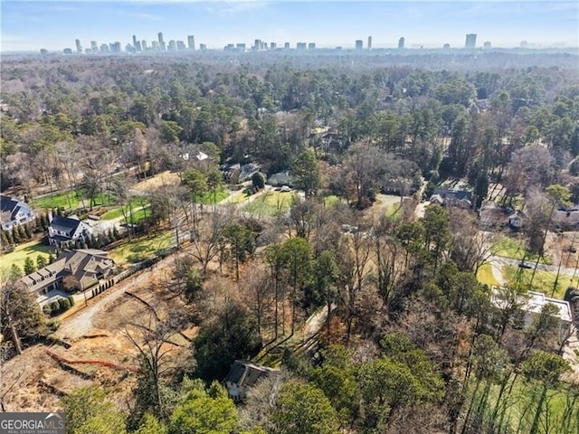 birds eye view of property featuring a city view