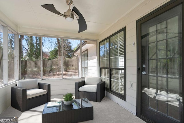 sunroom featuring a ceiling fan