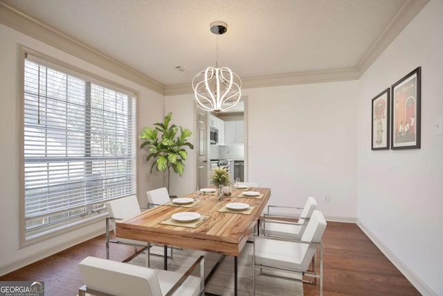 dining area featuring crown molding, an inviting chandelier, and dark wood-style flooring