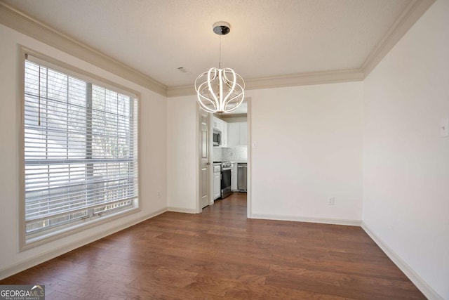 unfurnished dining area featuring crown molding, dark wood-type flooring, and a chandelier