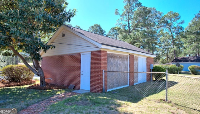 detached garage featuring fence