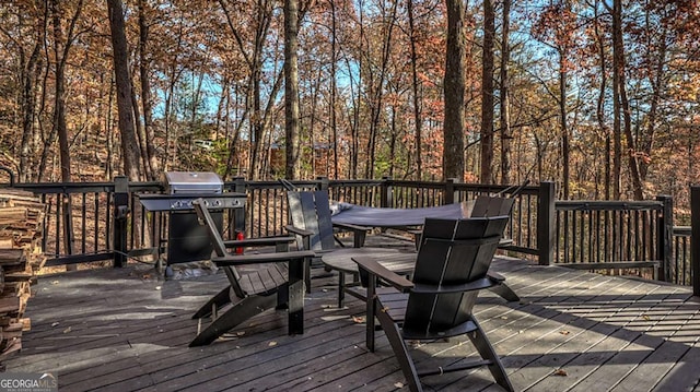 wooden deck with a grill