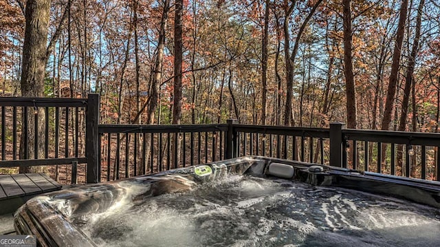 deck with a hot tub
