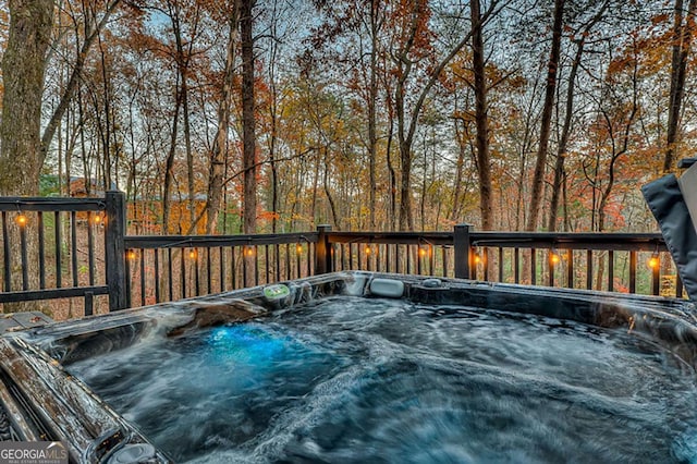 deck with a hot tub