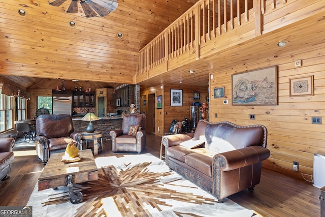 living room with hardwood / wood-style flooring, wooden walls, and wood ceiling