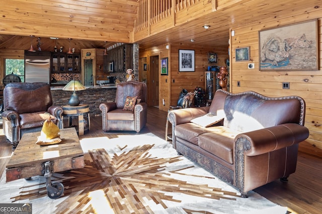 living room with wooden ceiling, wood finished floors, wood walls, and high vaulted ceiling