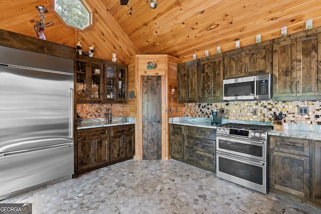 kitchen with vaulted ceiling, backsplash, wood ceiling, and appliances with stainless steel finishes