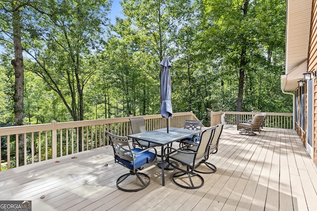 wooden deck featuring outdoor dining space