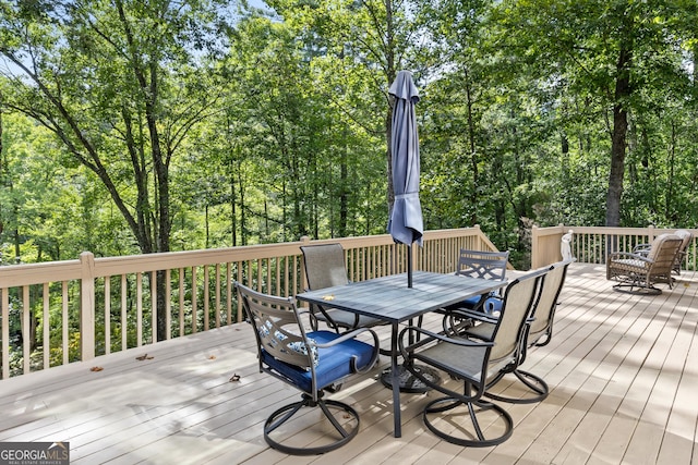 deck with outdoor dining area