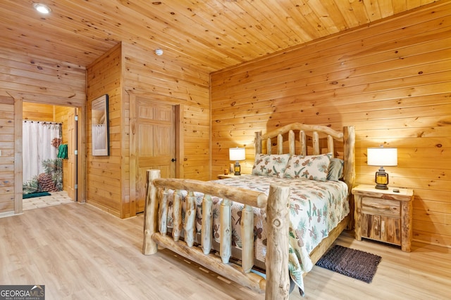 bedroom with wood walls, wood ceiling, and wood finished floors